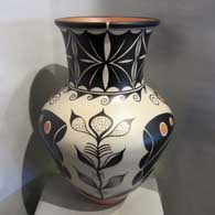 Traditional Santo Domingo geometric design on a tall neck polychrome jar