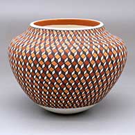 A polychrome jar decorated from top to bottom with an eye-dazzling geometric design
 by Frederica Antonio of Acoma
