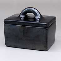 A rectangular, lidded plain black box
 by Rose Gonzales of San Ildefonso