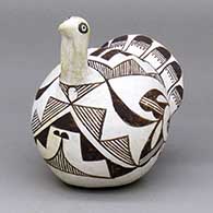 A classic black-on-white Acoma turkey figure decorated with a bird element and geometric design
 by Unknown of Acoma