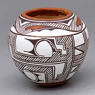 A small polychrome jar with a classic Zuni four-panel rainbird, fine line and geometric design
 by Anderson Peynetsa of Zuni