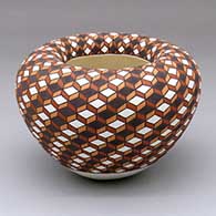 A polychrome Infinity bowl decorated from top to bottom with an eye-dazzling geometric design
 by Frederica Antonio of Acoma