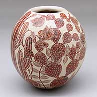 A polychrome jar decorated with a sgraffito desert wildlife and vegetation design