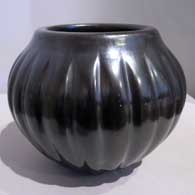 Angela Baca of Santa Clara Pueblo made this carved black melon jar