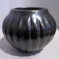 A carved black melon jar