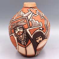 A jar carved and painted with a katsina and geometric design