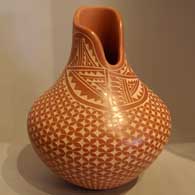 Polished red jar with sgraffito design