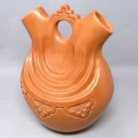 Red wedding vase with a lightly carved geometric design