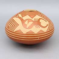 A sgraffito scorpion and geometric design on a red seedpot