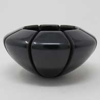 Carved black melon jar Black jar carved with a melon design