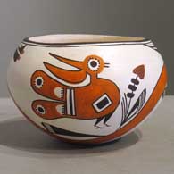 Bird, flower, rainbow and geometric design on a polychrome jar