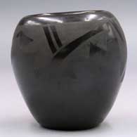 Black-on-black jar with a geometric design