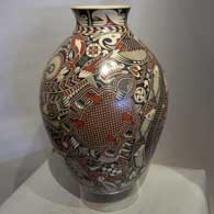 Polychrome pot with an intricate geometric design