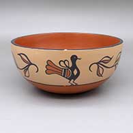 A polychrome bowl with a traditional Kewa design featuring bird and flower elements
