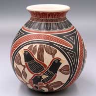 Polychrome jar with a 3-panel lightly carved, sgraffito and painted bird, branch, leaf and geometric design