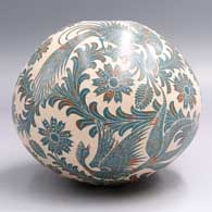 Polychrome jar etched with a bird, plant, flower and leaf design