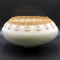 Large speckled and micaceous white bowl with a basket-weave rim