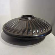 Black jar carved with feather design
