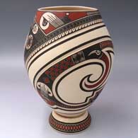 A polychrome jar lightly carved and painted with a Paquime-derived geometric design, plus a matching ceramic stand