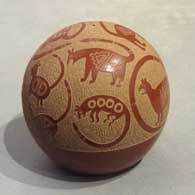 Sgraffito Mimbres animal designs on a red seed pot by Joseph Lonewolf