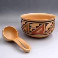 A polychrome bowl with matching ladle, both decorated with geometric designs