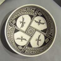 Mimbres bat and geometric design on a black and white plate