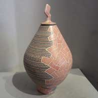 Sgraffito and painted geometric design on a polychrome jar