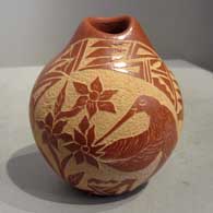 Red seedpot with sgraffito design Sgraffito design on a red seedpot
