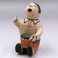 A sitting drummer figure