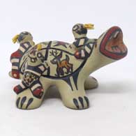 Polychrome turtle storyteller with animal, geometric design and 3 turtle children