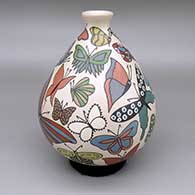 A polychrome jar decorated with a sgraffito-and-painted butterfly design