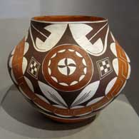 Rainbow, medallion and geometric design on a polychrome jar