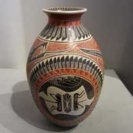 Sgraffito and painted grasshopper, serpent, feather and geometric design on a polychrome jar