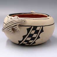 A polychrome bowl with lizard appliques and a geometric design