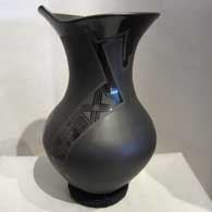 Geometric design and organic opening on a black on black on black jar