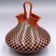 A polychrome wedding vase with a cuadrillos-based geometric design