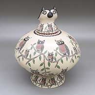 An owl effigy lid tops a pot decorated with a sgraffito and painted owl-on-a-branch and geometric designs, with a matching custom stand
