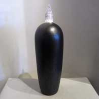 Silver inlay in a black jar