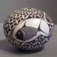 Polychrome seedpot with Mimbres and geometric design Mimbres and geometric design on a polychrome seedpot
