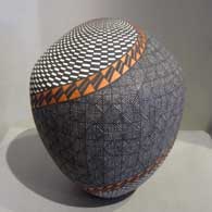 Spiral, fine line and geometric design on a polychrome jar