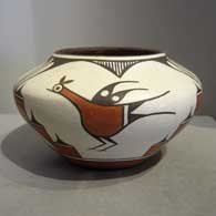 Roadrunner, rain, cloud and geometric design on a polychrome jar, by Sofia Medina