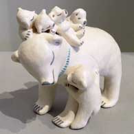Five cubs on a bear storyteller figure, made by Isleta Pueblo potter Stella Teller