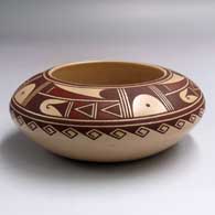 A polychrome bowl with a 4-panel geometric design