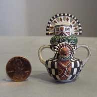 Miniature pot with 3 lids, 4 faces and double handles