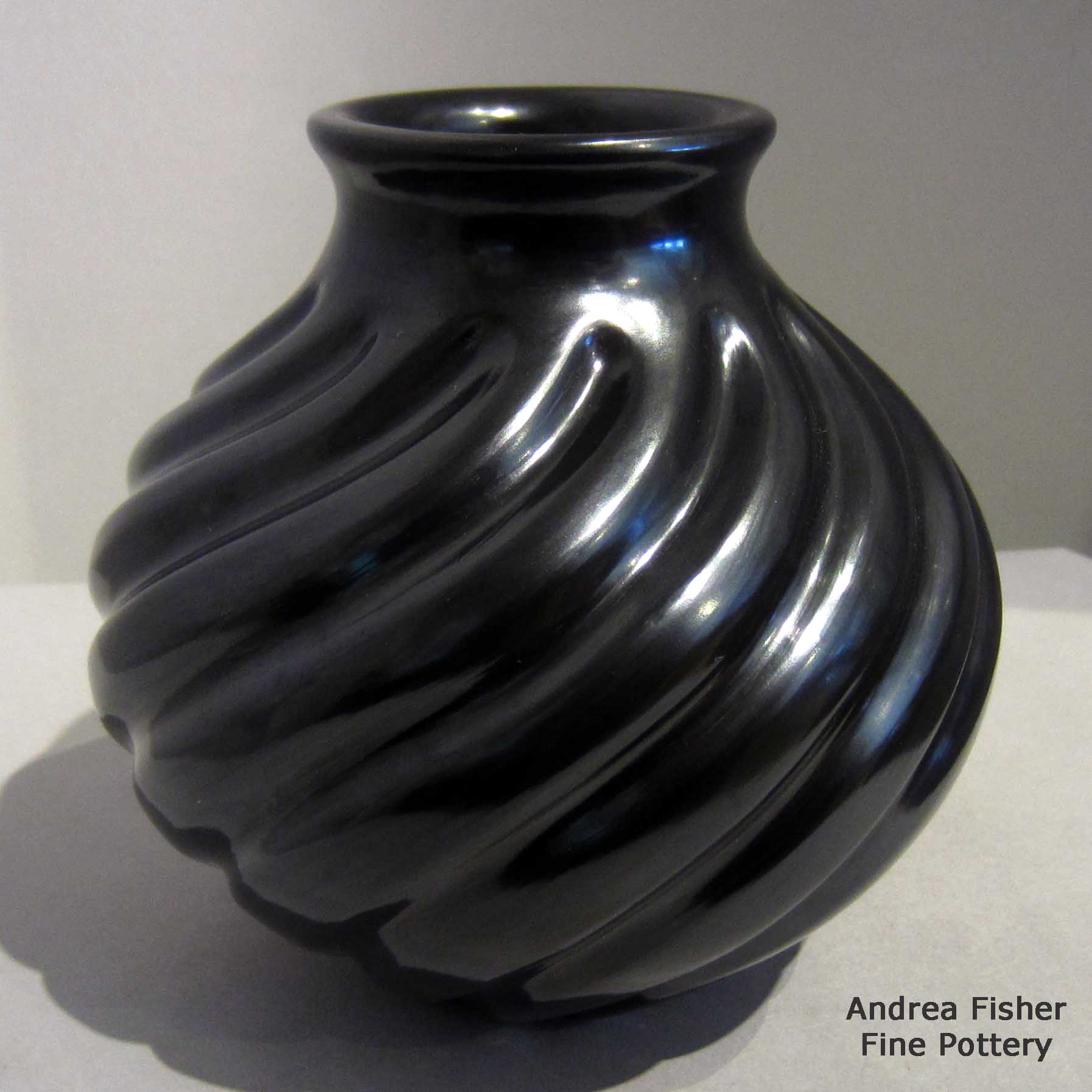Click or tap to see a larger view Black jar carved with swirl melon design made by Nathan Youngblood of Santa Clara