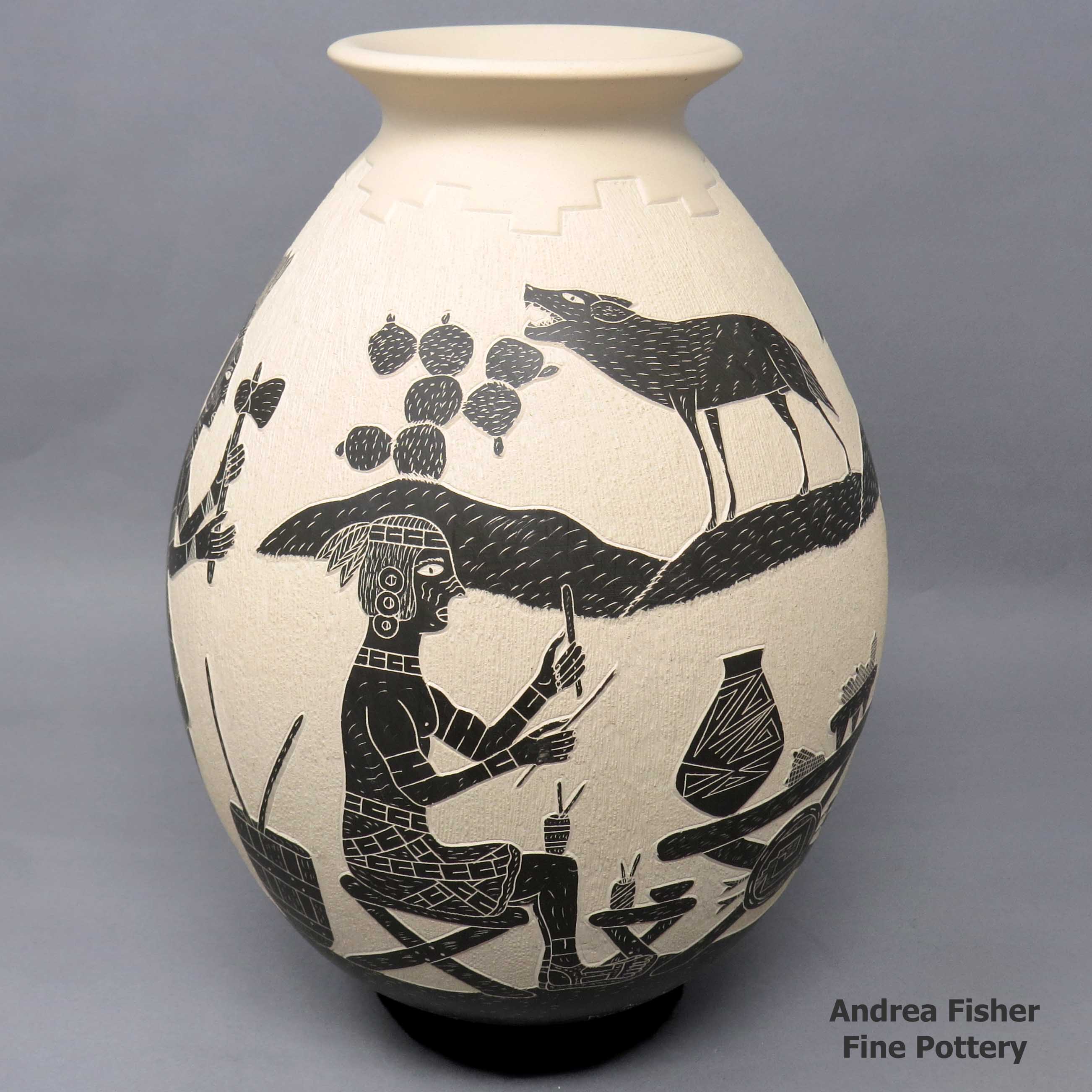Click or tap to see a larger view Black and white jar with sgraffito Aztec family yard design
made by Humberto Guillen Rodriguez of Mata Ortiz and Casas Grandes