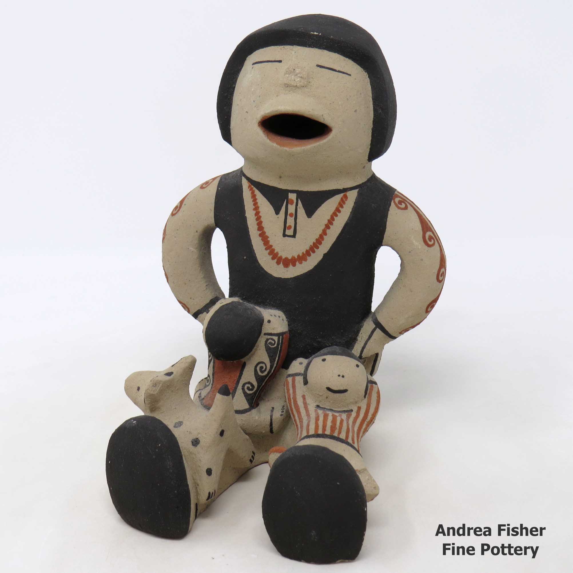 Click or tap to see a larger view Grandfather storyteller with 2 children and a puppy
made by Buffy Cordero of Cochiti