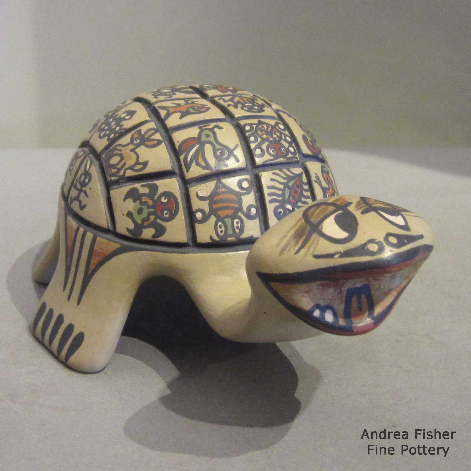 Margaret and Luther Gutierrez created this piece Polychrome turtle with animal and geometric design