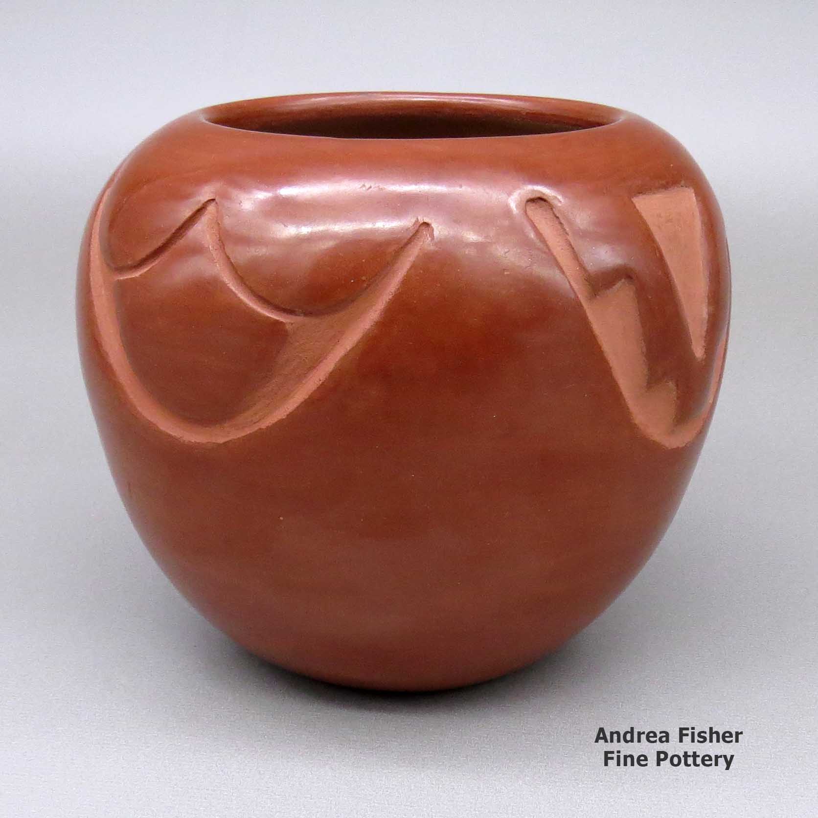 Click or tap to see a larger view Red jar carved with 4-direction geometric design made by Rose Gonzales of San Ildefonso