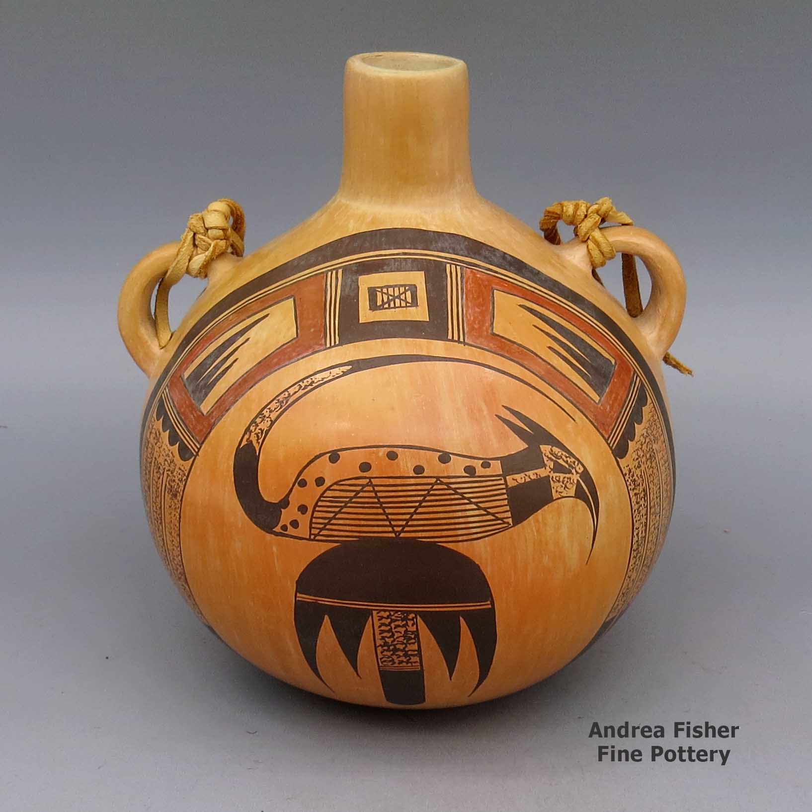 Polychrome canteen with bird and geometric design, fire clouds, and leather strap made by Jean Sahmie of Hopi